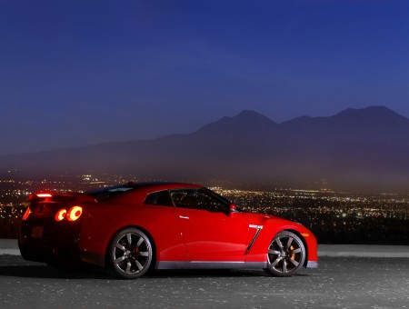 Red Nissan GT-R R35 Parked On Grey Pavement