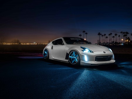 White Nissan GTR R35 With Opened Headlights