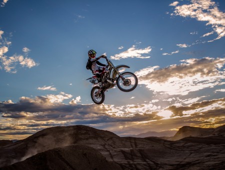 Dirt Biker Performing Moto Stunt During Daytime