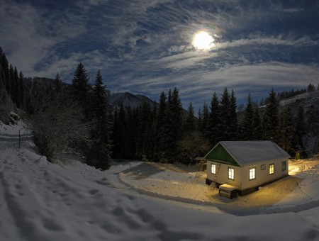 White Cabin On A Snowy Mountainside