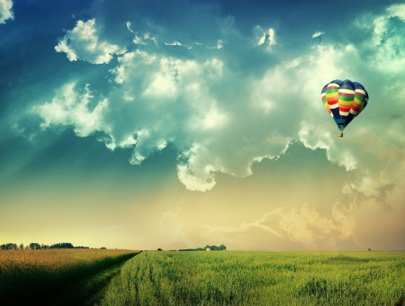Rainbow Hot Air Balloon Under White Cloudy Blue Sky