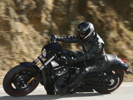 Man In Black Jacket Riding Black And Silver Cruiser Motorcycle