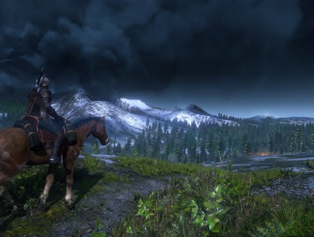 Man Riding Brown Horse Facing Mountain Under Dark Sky