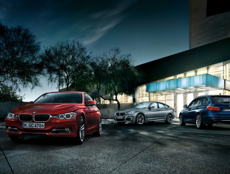 Red And Gray BMW Coupe And Blue Bmw Hatchback Car