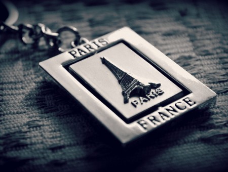 Silver Paris France Keychain On Gray Textile