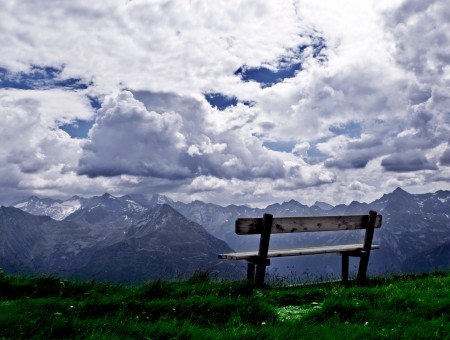 White Cloudy Sky Over Brown Bench During Daytime