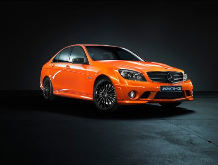 Orange Mercedes Benz AMG Sedan