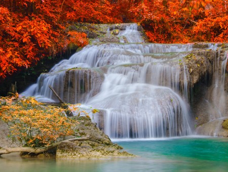 Waterfalls Beside Orange Leafed Trees During Daytime