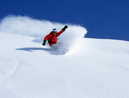 Man In Red Jacket Riding On Snowboard Under Blue Sky