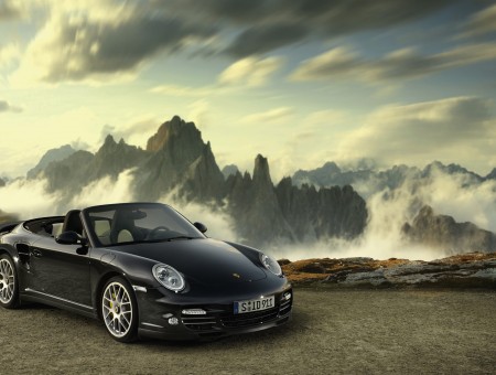Black Porsche Boxster Parked On Grey Pavement Near Cliff
