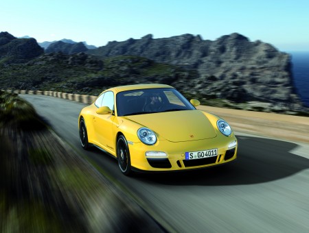 Yellow Porsche Carrera Running On Highway