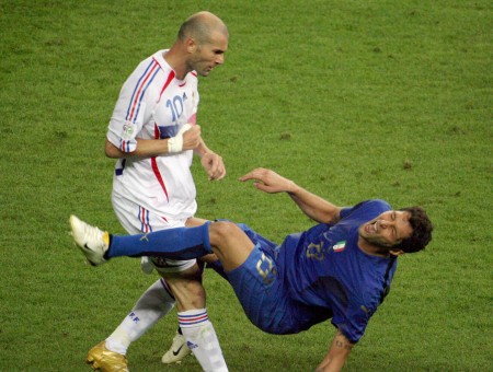 Man In White Shirt Playing With Man In Blue Jersey Shirt