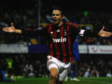 Man In Black And Red Striped Soccer Jersey Running With Arms Wide Open