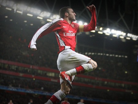Soccer Player In Red And White Nike Emirated Jersey Shirt Leaps On Air