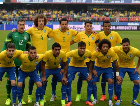 Group Photo Of Men On Soccer Field Wearing Yellow Soccer Jersey