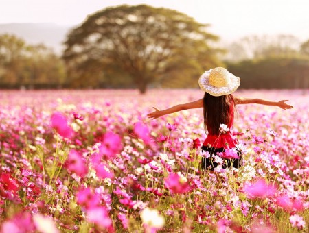 Woman Standing In Pink Flowers