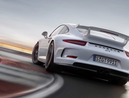 White Porsche Carrera GT On Race Track