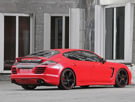 Red Porsche Panamera In Front Of Building