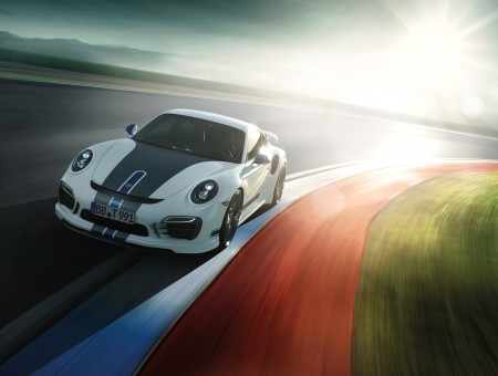 White And Black Porsche 911 Driving On Track
