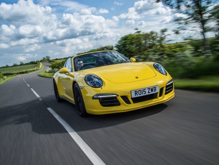 Yellow Porsche Cayman On Road During Daytime