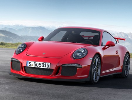 Red Porsche 911 On Paved Road During Daytime