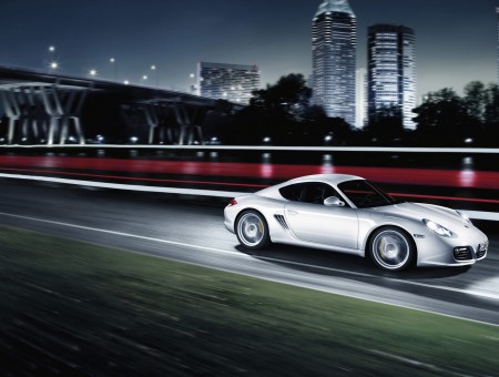 Gray Porsche Carrera On Road During Night