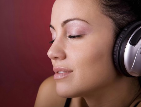 Woman Wearing Gray And Black Headphones