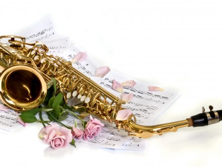 Brass Metal Saxophone On White Printer Paper