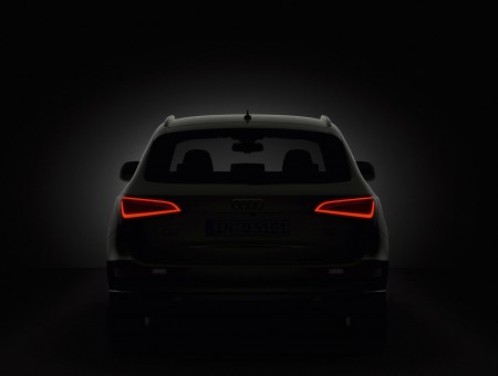 Car With Red Tail Light In Grayscale Photography