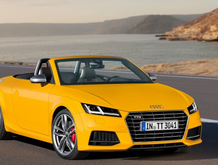 Yellow Audi Convertible Next To Ocean