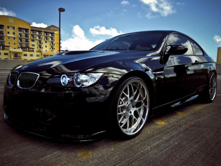 Black BMW Coupe Parked On Parking Area During Daytime