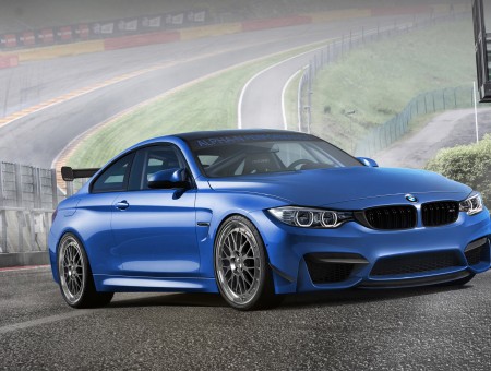 Blue BMW Coupe On Race Track During Daytime