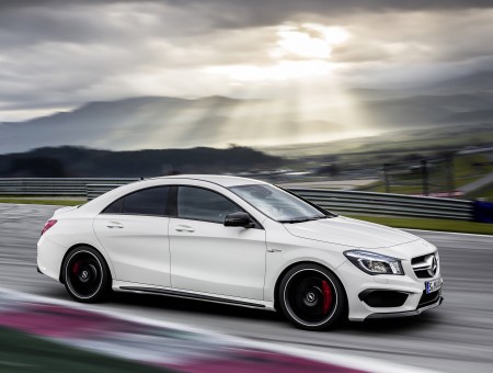 White Mercedes Benz C Class On Track Under Gey Cloudy Sky During Daytime