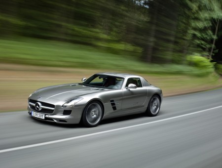 Silver Mercedes Benz SLS AMG On Road During Daytime