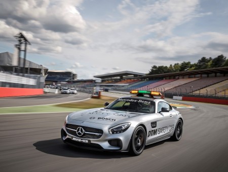 Silver Mercedes Benz AMG Coupe On Race Track