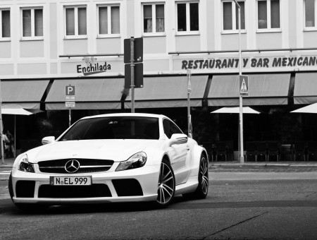 White Mercedes In Front Of Buidling