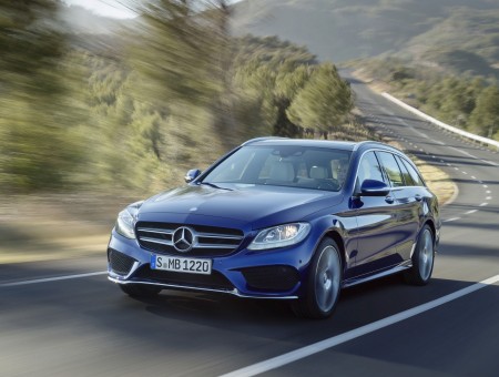 Blue Mercedes Benz Sedan On Road In Panning Photography During Daytime