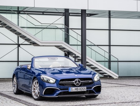 Blue Mercedes Benz Convertible In Front Of Stairs