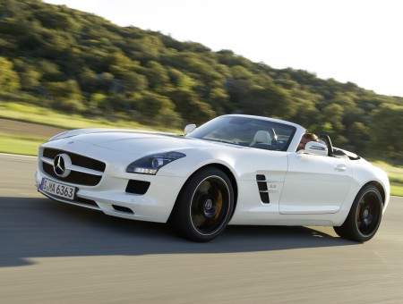 White Mercedes Benz SLS AMG Convertible On Road During Daytime