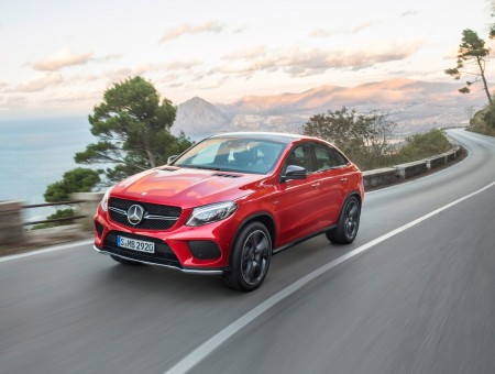 Red Mercedes Benz GLE On Winding Road