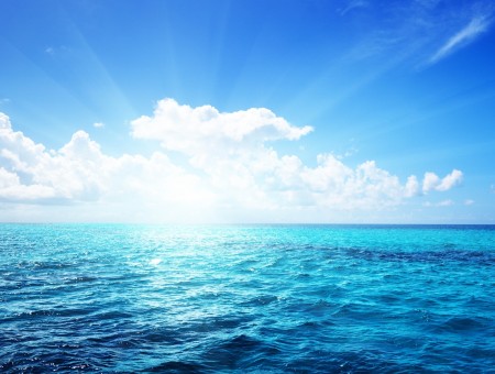Ocean With Blue Sky And White Clouds