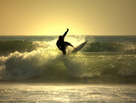 Silhouette Of Person Surfing