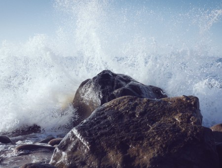 Sea Waves Crashing On Seashore Rocks