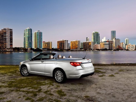 Silver Convertible Near Body Of Water During Daytime