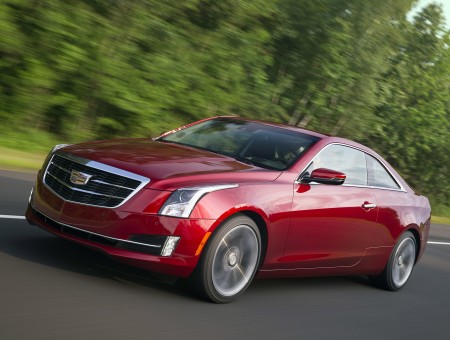 Red Cadillac ATS On Paved Road