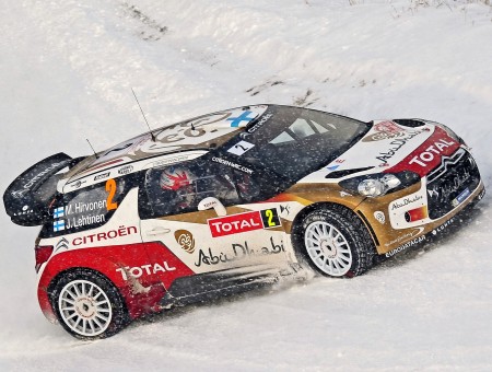 Red And White Citroen Total Rally Car Traveling On White Snow Covered Road