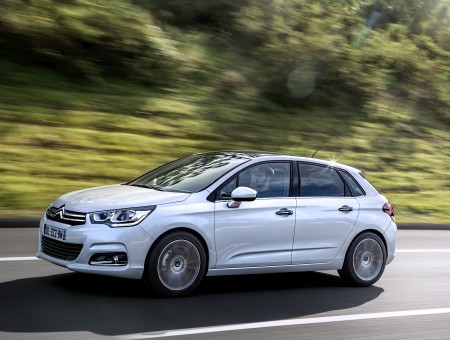 Silver Citroen C4 On The Road During Daytime