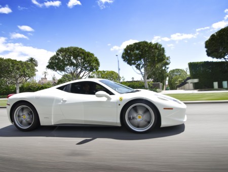 White Ferrari 458 Driving At Daytime