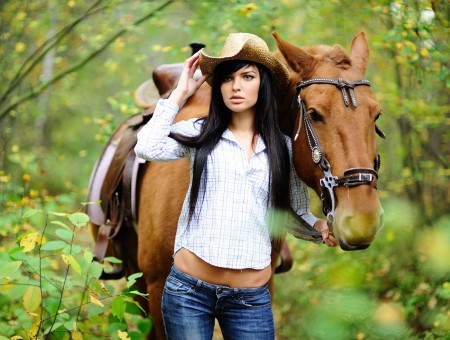 Woman Holding Brown Horse Inside Forest