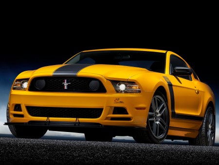 Yellow And Black Ford Mustang Car In A Dark Room